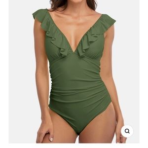 Women’s one piece ruffled swimsuit.  Ruched waist dark green color.  Size medium